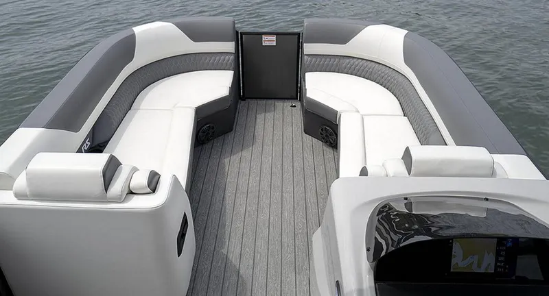 Slide: The Image of 2025 Lowe RS 250 WT boat interior with gray and white seating on water. - 3