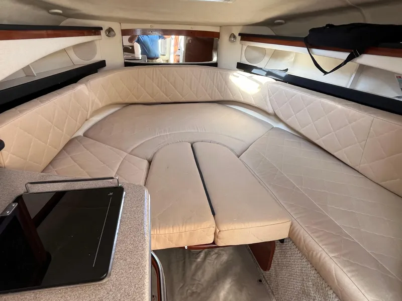Slide: The Image of Interior of 2007 Sea Ray 270 Amberjack with beige seating and table. - 15