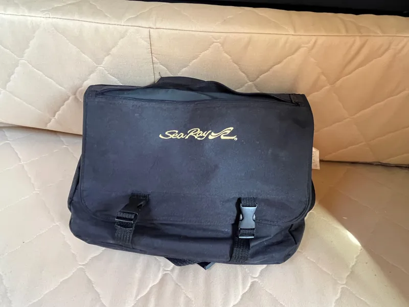 Slide: The Image of Black Sea Ray bag on beige quilted seat, 2007 Sea Ray 270 Amberjack. - 16