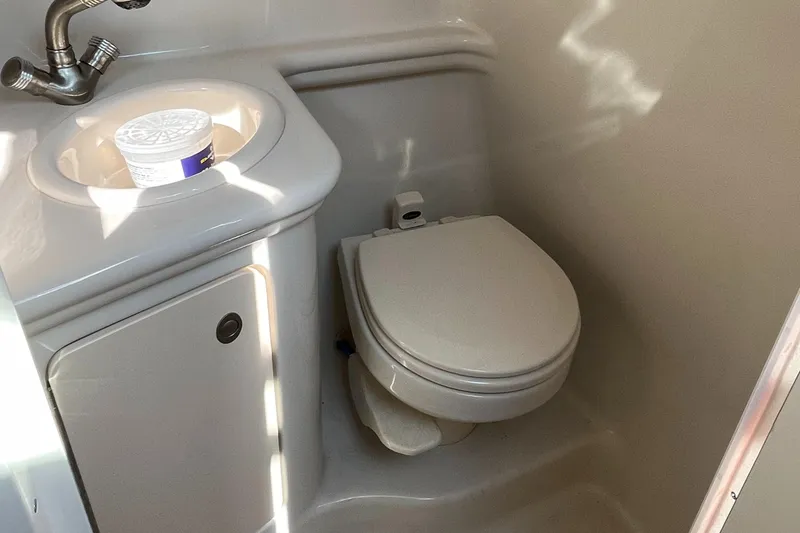 Slide: The Image of 2007 Sea Ray 270 Amberjack boat bathroom with sink and toilet. - 23