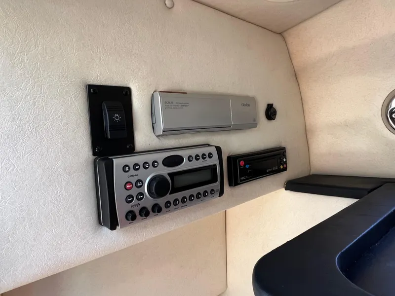 Slide: The Image of 2007 Sea Ray 270 Amberjack cabin electronics panel with stereo and controls. - 25