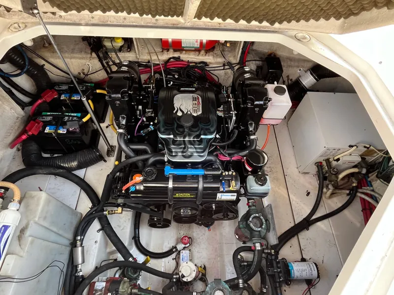 Slide: The Image of Engine compartment of 2007 Sea Ray 270 Amberjack, showcasing detailed mechanical components. - 27