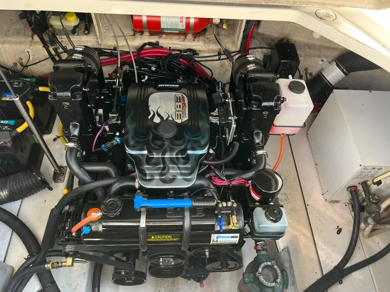 Slide: The Image of Engine compartment of 2007 Sea Ray 270 Amberjack, featuring a MerCruiser 383 engine. - 28