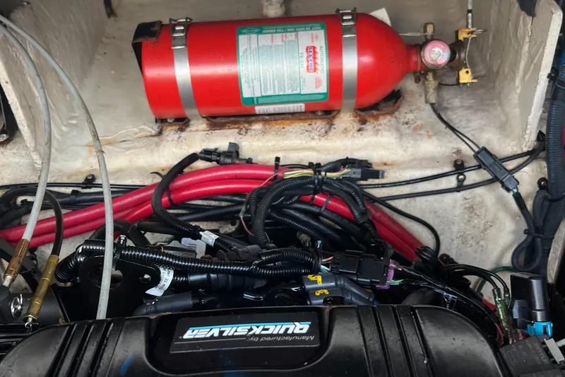 Slide: The Image of Engine compartment of 2007 Sea Ray 270 Amberjack with fire extinguisher and wiring. - 29