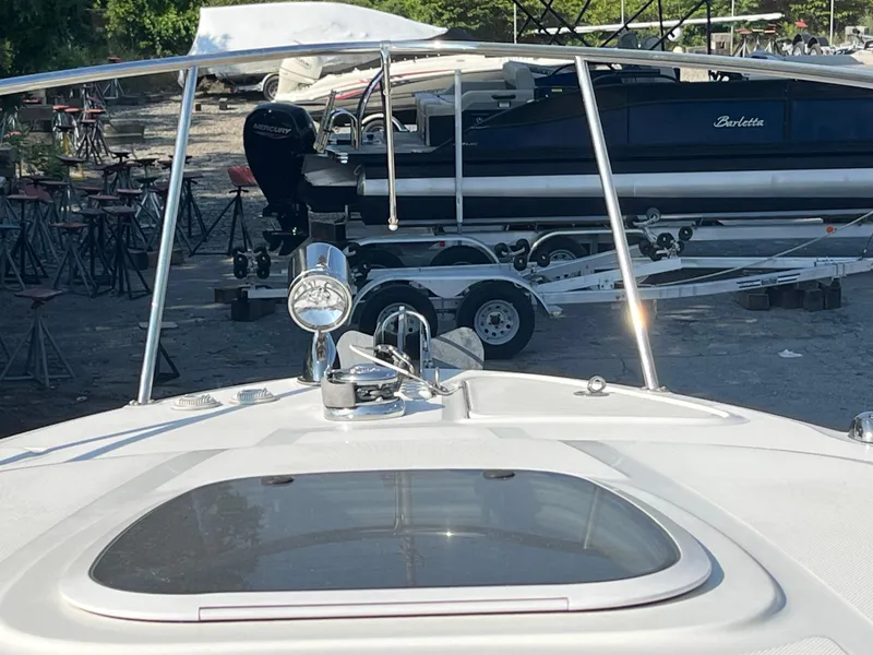 Slide: The Image of 2007 Sea Ray 270 Amberjack boat with trailer in a marina setting. - 33