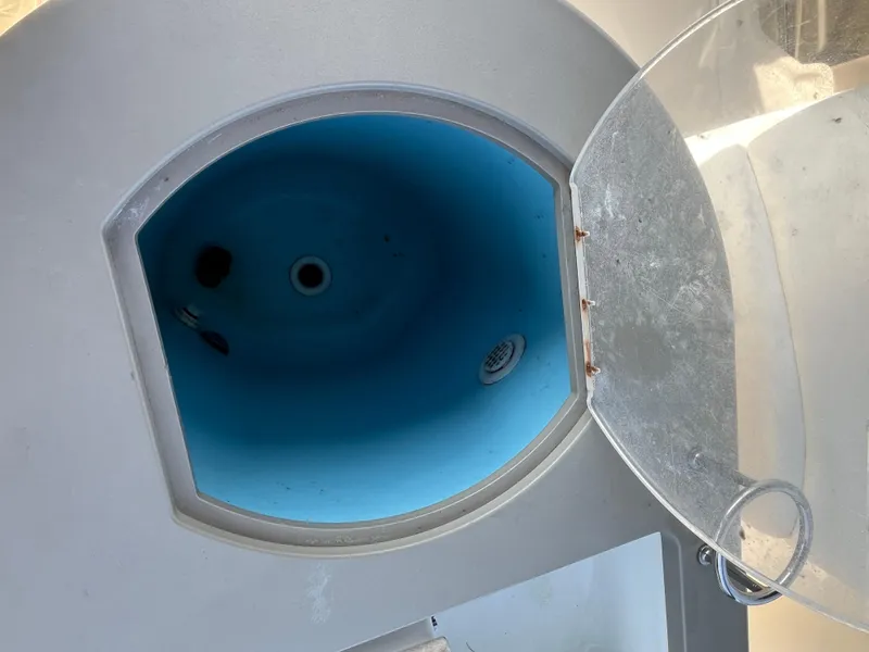 Slide: The Image of Open hatch on 2007 Sea Ray 270 Amberjack boat, showing blue interior compartment. - 8