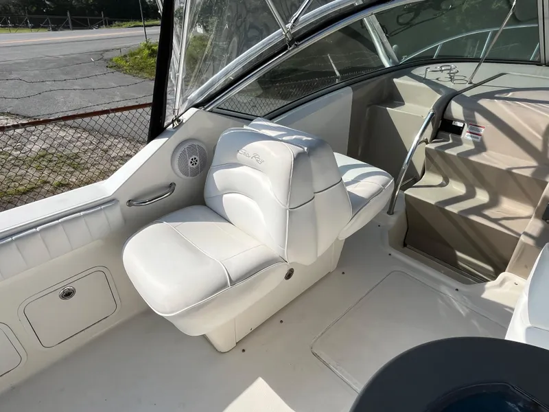 Slide: The Image of 2007 Sea Ray 270 Amberjack boat interior with white seating and dashboard. - 9
