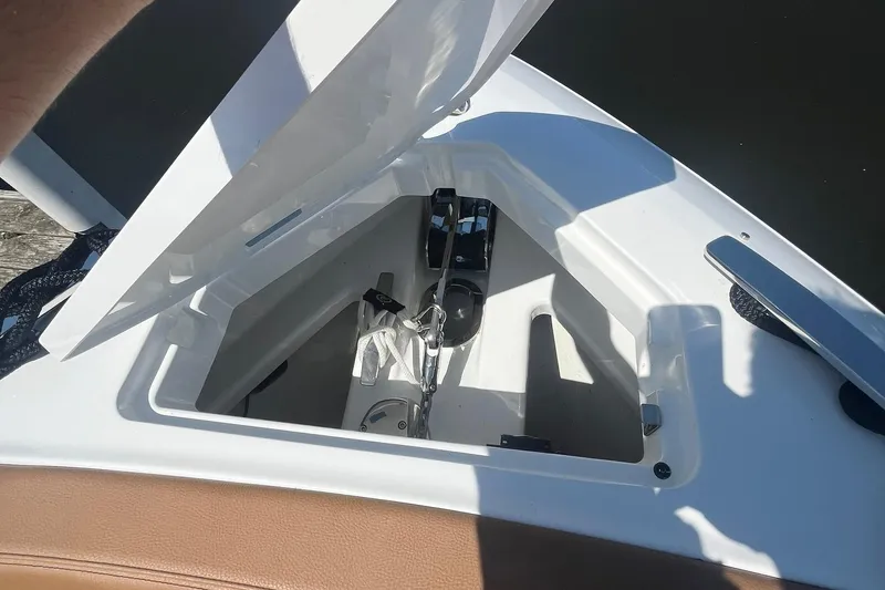 Slide: The Image of Open storage compartment on 2024 Cobalt R33 boat, featuring sleek design and modern amenities. - 14