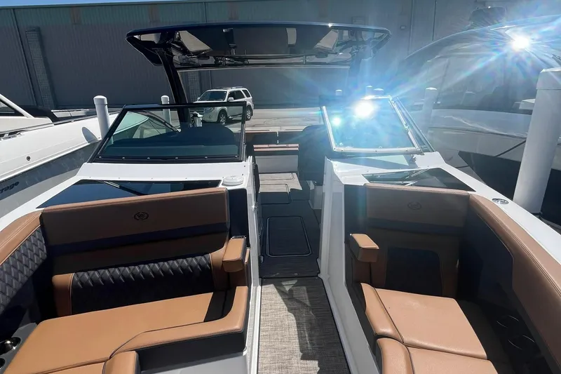 Slide: The Image of 2024 Cobalt R33 boat interior with luxurious seating and modern design. - 15