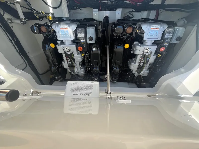 Slide: The Image of Engine compartment of a 2024 Cobalt R33 boat, showcasing dual engines. - 16