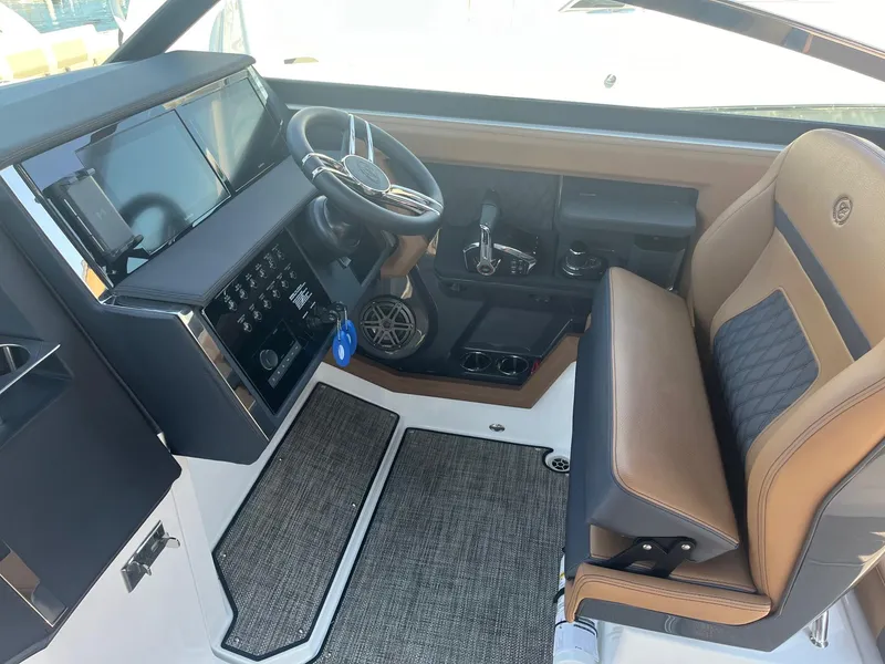 Slide: The Image of 2024 Cobalt R33 boat interior with modern dashboard and luxurious seating. - 6