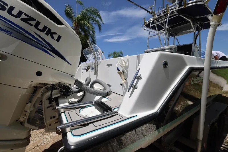 Slide: The Image of 2001 Contender 27 Open boat with Suzuki outboard motor. - 10