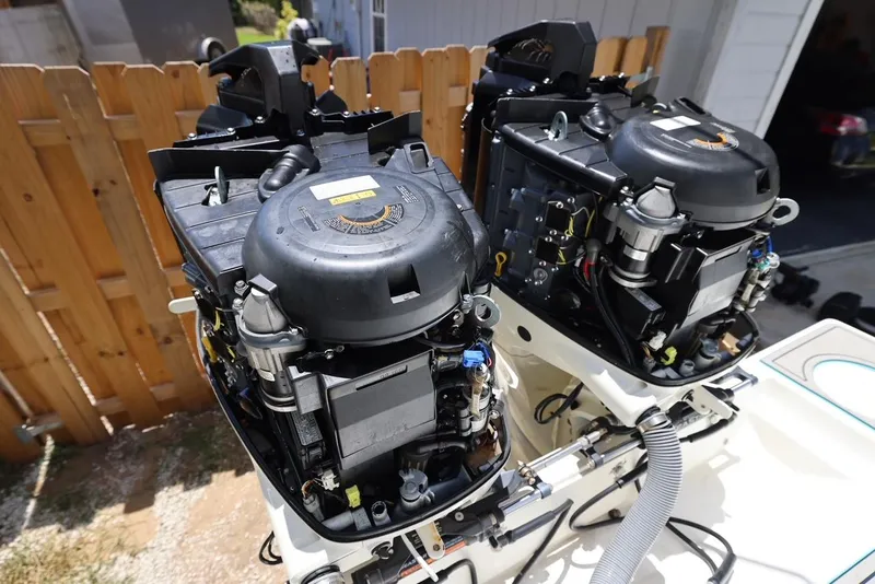 Slide: The Image of Twin outboard engines on a 2001 Contender 27 Open boat. - 24