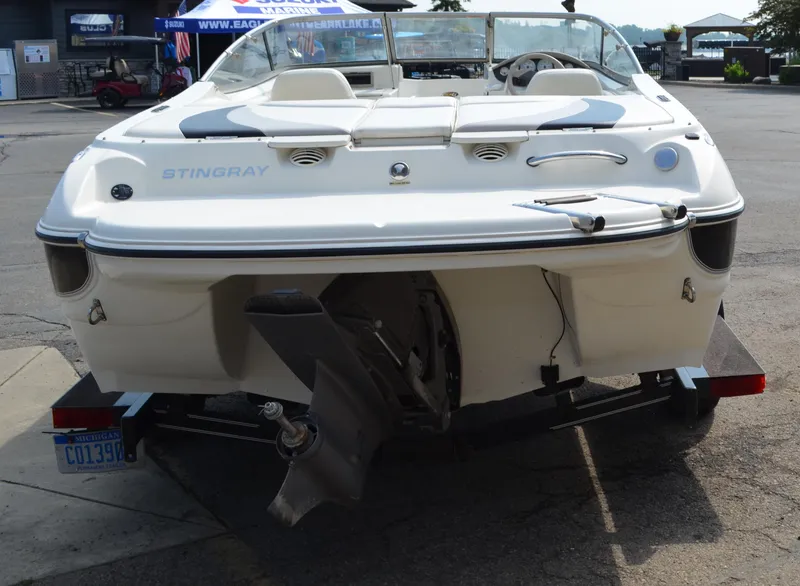 Slide: The Image of 2009 Stingray 205LX boat rear view with outboard motor on trailer. - 3