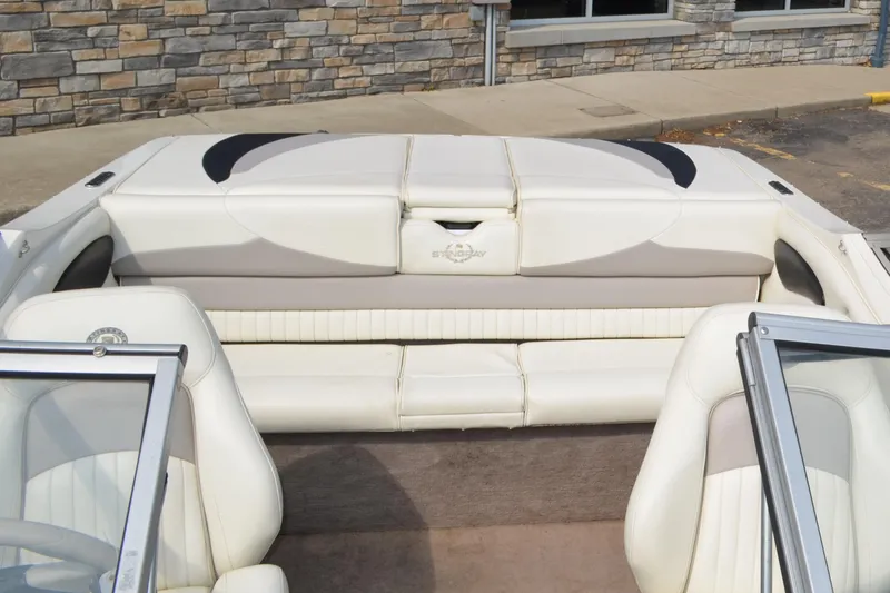 Slide: The Image of 2009 Stingray 205LX boat interior with white leather seats and windshield. - 8