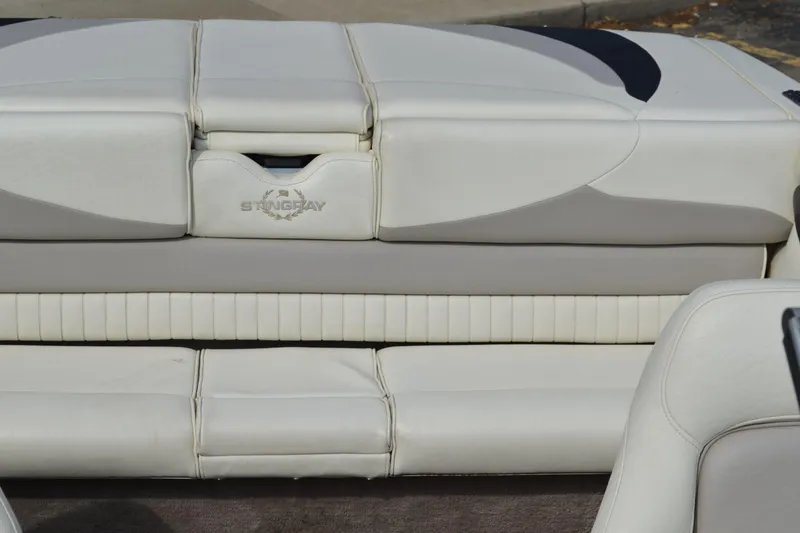 Slide: The Image of 2009 Stingray 205LX boat interior with white leather seating. - 9