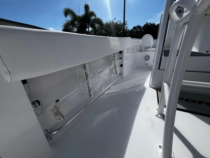 Slide: The Image of 2026 Sportsman Open 212 Center Console boat interior with sleek white design and spacious deck. - 16
