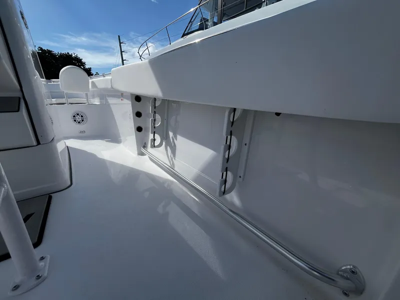 Slide: The Image of 2026 Sportsman Open 212 Center Console boat interior, featuring sleek white design and modern amenities. - 17