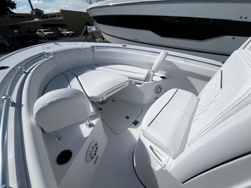 Slide: The Image of 2026 Sportsman Open 212 Center Console boat interior with white seating and modern design. - 20