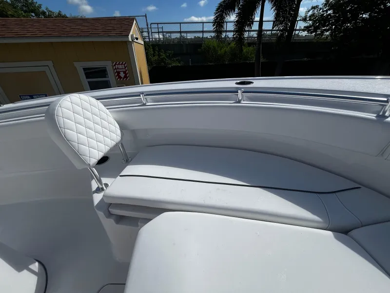Slide: The Image of 2026 Sportsman Open 212 Center Console boat with white seating and sleek design. - 21
