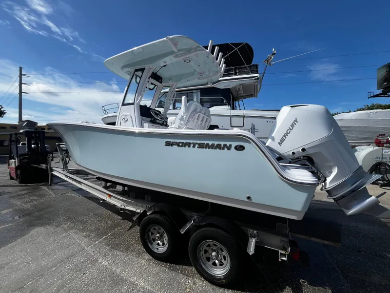 Slide: The Image of 2026 Sportsman Open 212 Center Console boat on trailer, featuring Mercury engine. - 4