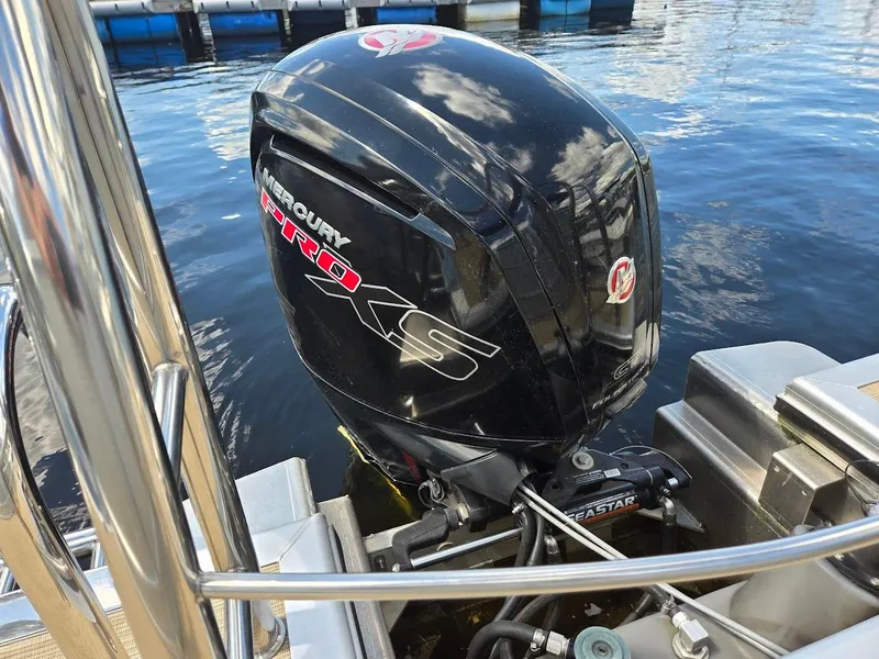 Slide: The Image of Mercury Pro XS outboard motor on 2021 Harris Cruiser 230 boat. - 7