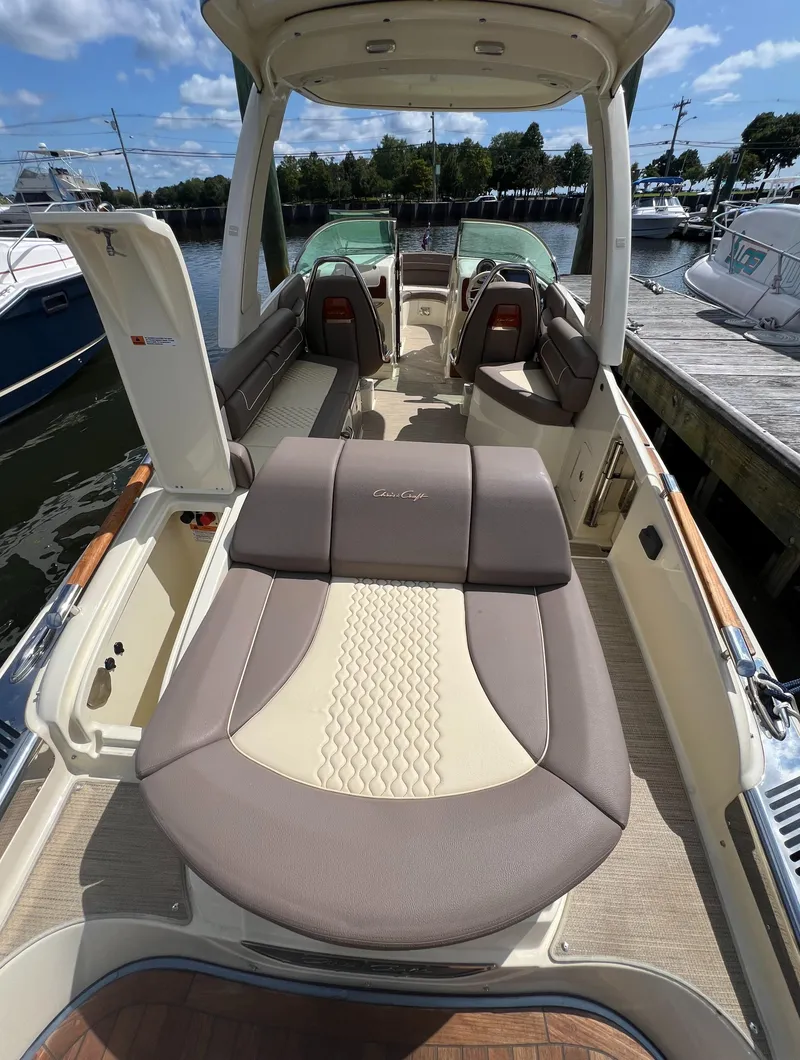 Slide: The Image of 2023 Chris-Craft Launch 28 GT boat interior with luxurious seating and elegant design. - 11