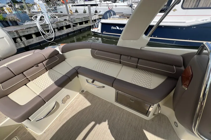 Slide: The Image of Luxurious seating on 2023 Chris-Craft Launch 28 GT boat at marina. - 16