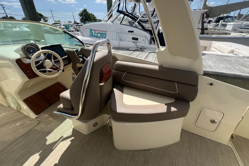 Slide: The Image of 2023 Chris-Craft Launch 28 GT interior with luxurious seating and modern dashboard. - 21