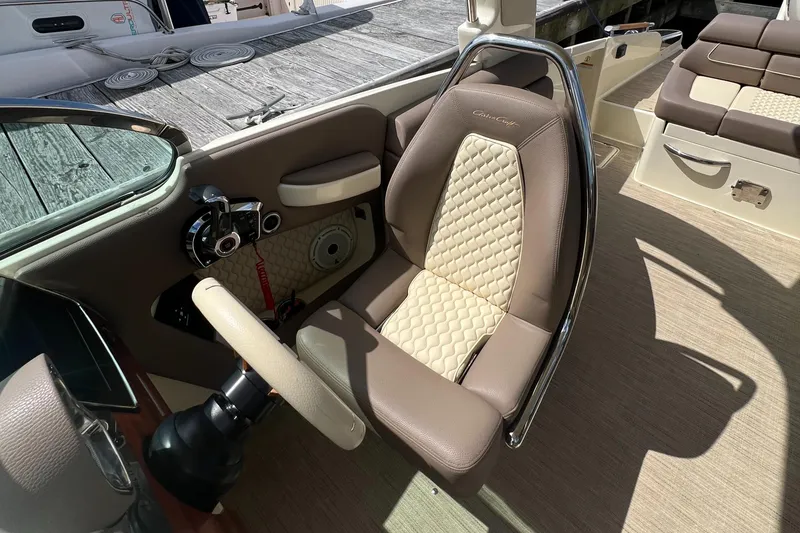 Slide: The Image of 2023 Chris-Craft Launch 28 GT cockpit with luxurious seating and modern controls. - 24