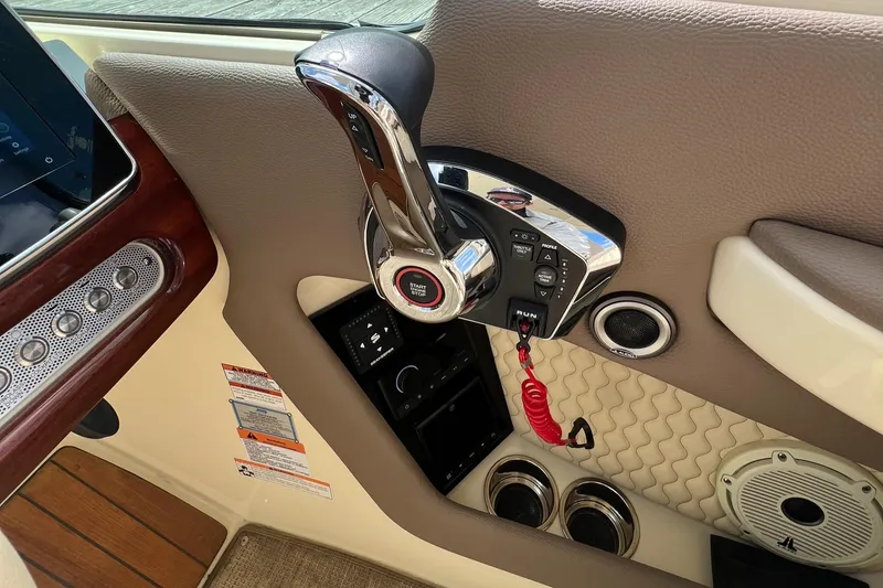 Slide: The Image of 2023 Chris-Craft Launch 28 GT boat control panel with throttle and speaker. - 29
