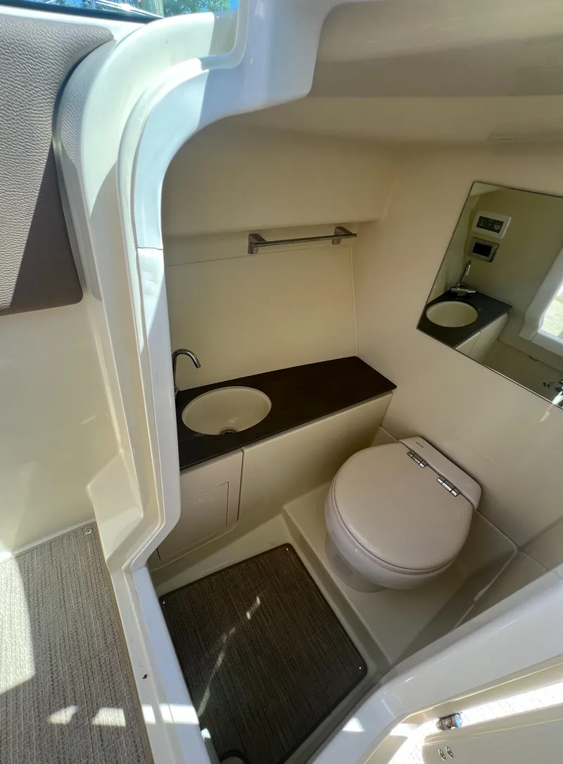 Slide: The Image of 2023 Chris-Craft Launch 28 GT boat interior bathroom with sink and toilet. - 31
