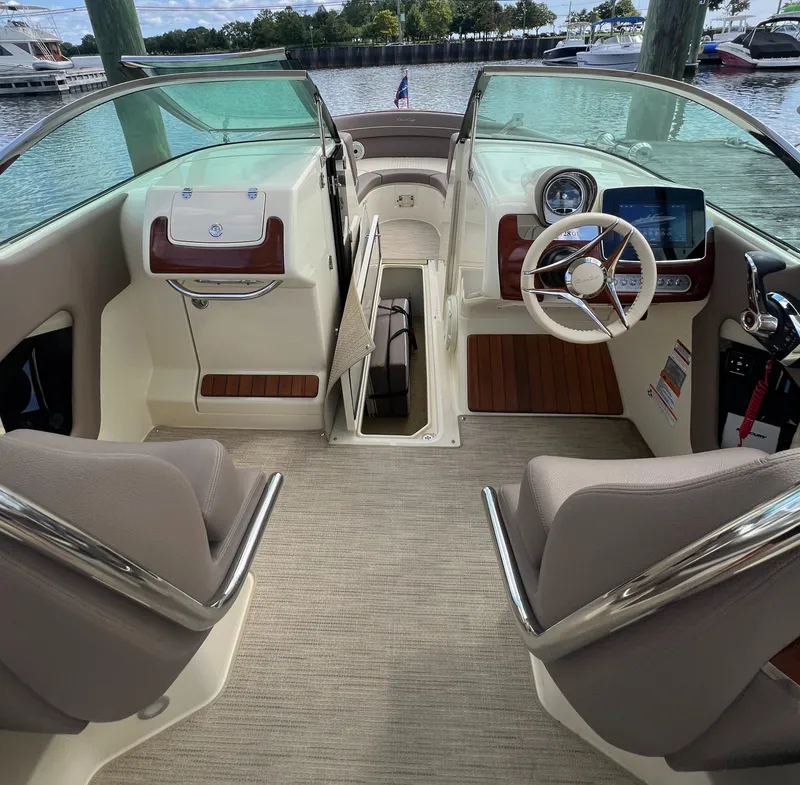 Slide: The Image of 2023 Chris-Craft Launch 28 GT interior with modern dashboard and seating. - 35