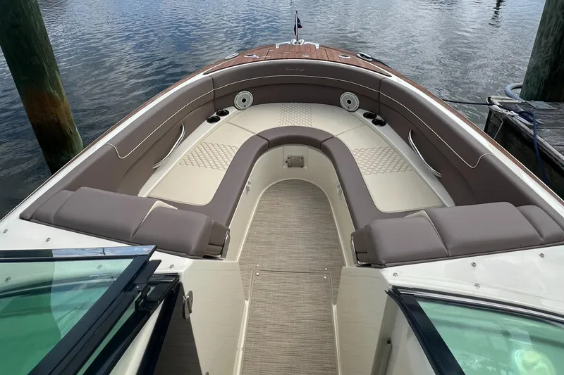 Slide: The Image of 2023 Chris-Craft Launch 28 GT boat interior with elegant seating and water view. - 36
