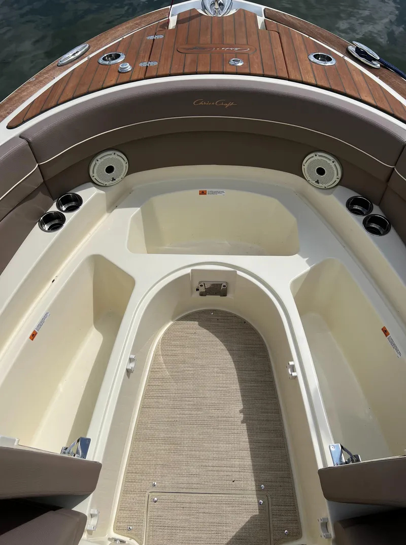 Slide: The Image of 2023 Chris-Craft Launch 28 GT boat interior with teak accents and seating. - 41