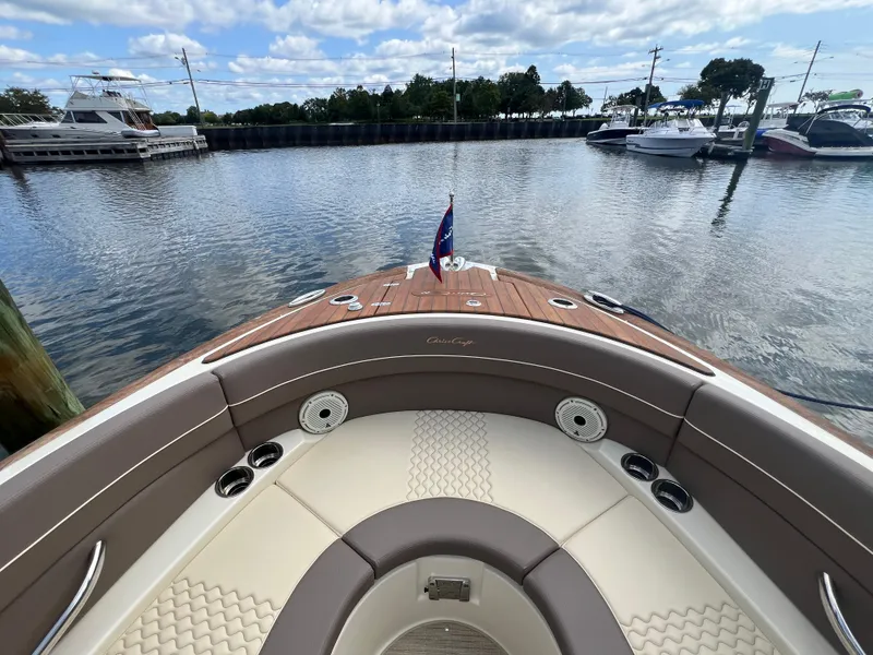 Slide: The Image of 2023 Chris-Craft Launch 28 GT boat interior with elegant seating and waterfront view. - 42