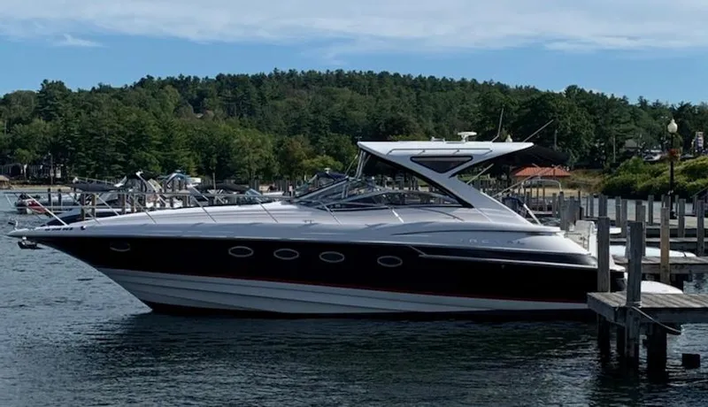 The Image of 2007 Regal 4460 Commodore yacht docked on a serene lake. - 0