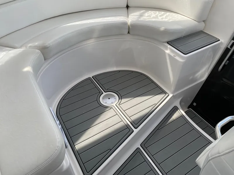 Slide: The Image of 2007 Regal 4460 Commodore boat interior with cushioned seating and sleek flooring. - 22