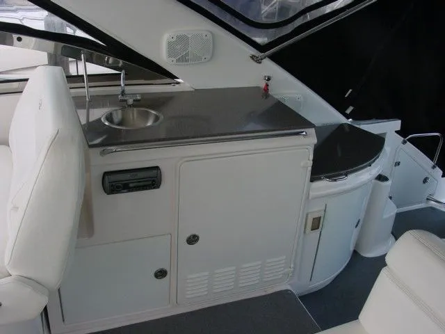 Slide: The Image of 2007 Regal 4460 Commodore yacht interior with sink and storage cabinets. - 6