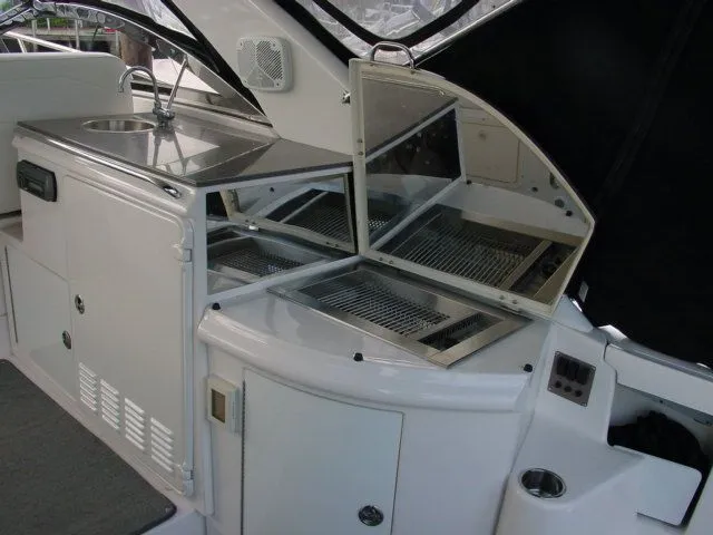 Slide: The Image of 2007 Regal 4460 Commodore yacht kitchen area with sink and storage compartments. - 7