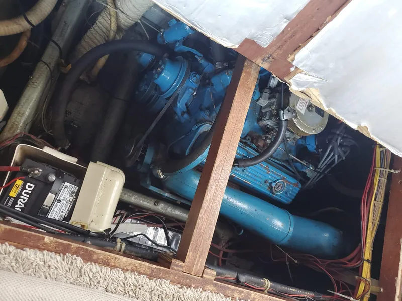Slide: The Image of Engine compartment of 1983 Carver 3207 AFT Cabin Motor Yacht with visible wiring and battery. - 2