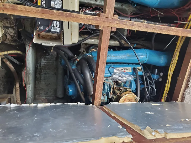 Slide: The Image of Engine compartment of a 1983 Carver 3207 AFT Cabin Motor Yacht, showing mechanical components. - 24