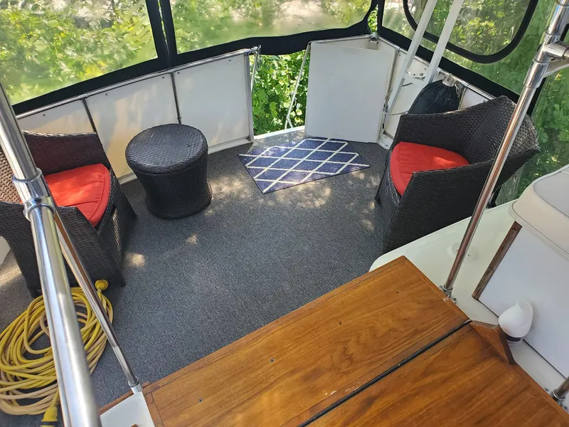 Slide: The Image of 1983 Carver 3207 AFT Cabin Motor Yacht interior with seating and carpeted floor. - 5