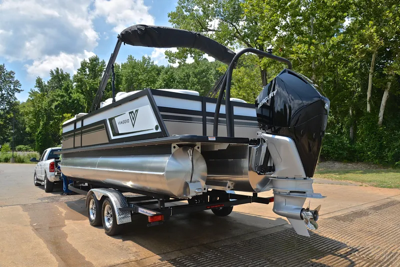 Slide: The Image of 2023 Viaggio Diamante 23 U Platinum pontoon boat on trailer, parked outdoors. - 12