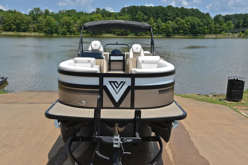 Slide: The Image of 2023 Viaggio Diamante 23 U Platinum pontoon boat on a trailer by a lake. - 17