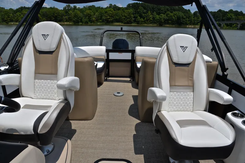 Slide: The Image of 2023 Viaggio Diamante 23 U Platinum boat interior with luxurious seating on a calm lake. - 22