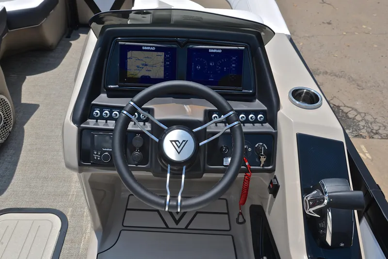 Slide: The Image of 2023 Viaggio Diamante 23 U Platinum boat dashboard with dual Simrad displays and steering wheel. - 25