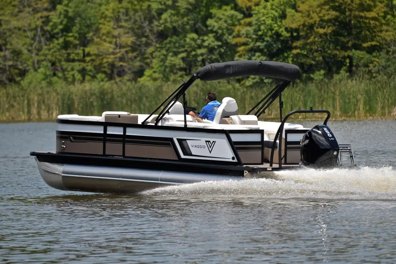Slide: The Image of 2023 Viaggio Diamante 23 U Platinum pontoon boat cruising on a lake. - 4