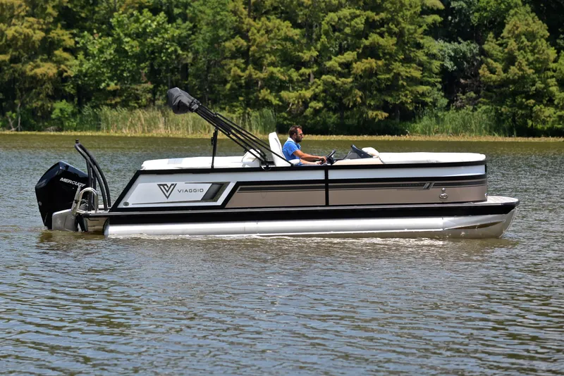 Slide: The Image of 2023 Viaggio Diamante 23 U Platinum pontoon boat cruising on a lake. - 6