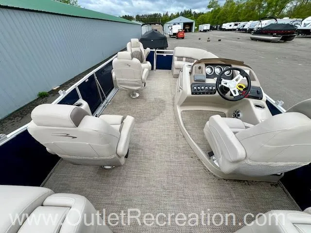 Slide: The Image of 2017 Bennington 23 RSR pontoon boat interior with plush seating and modern dashboard. - 15